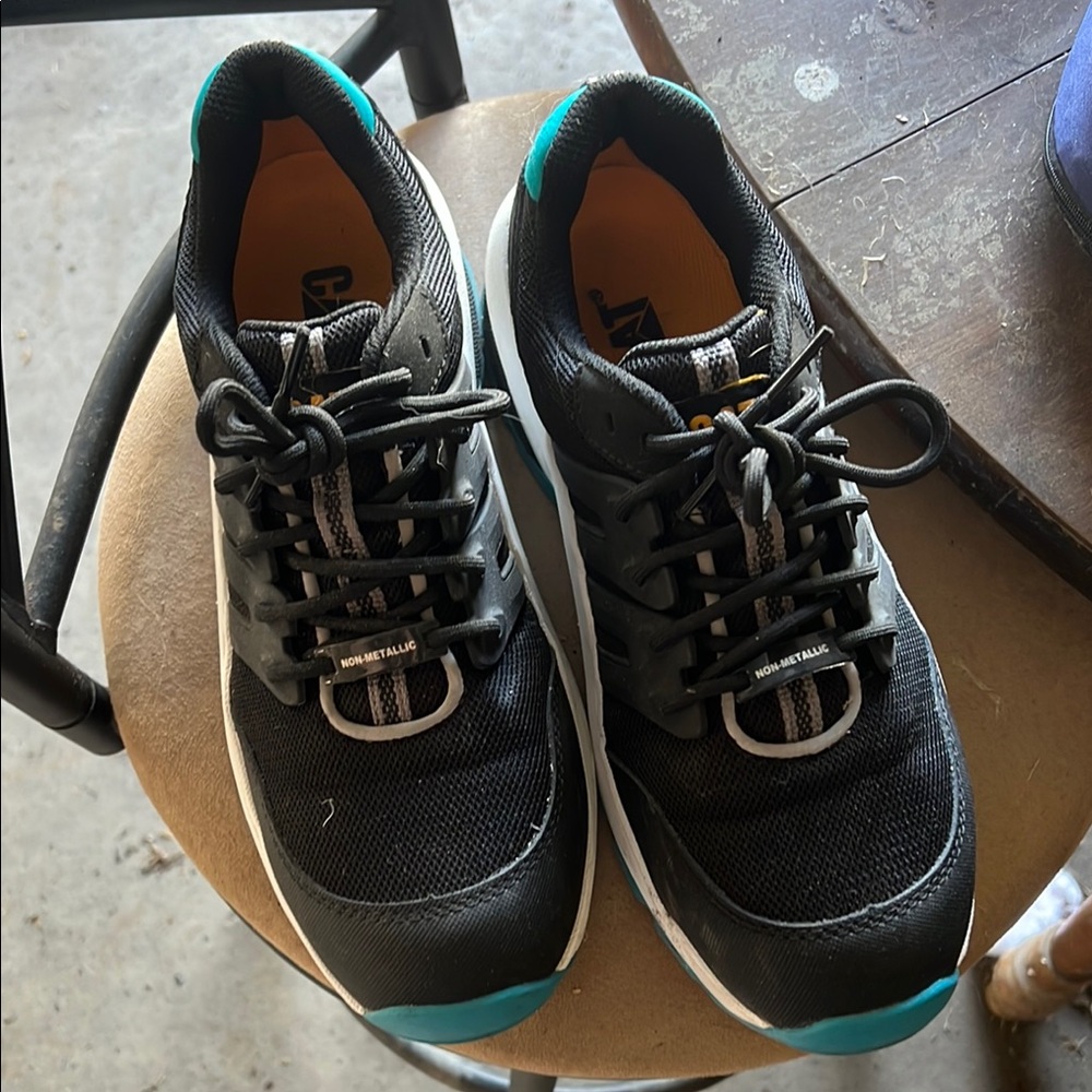 Women’s black and teal CAT steel toe shoes